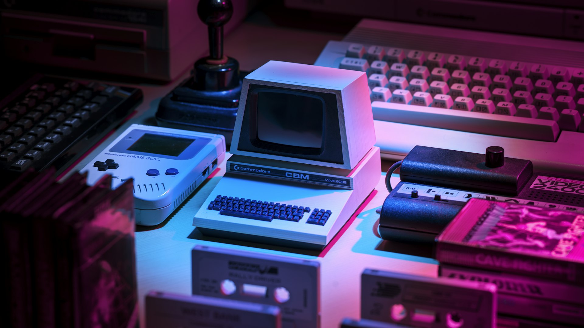 Player at a desk lit by monitor glow